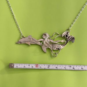 Wild Ride, a mermaid swimming with a dolphin, in sterling silver
