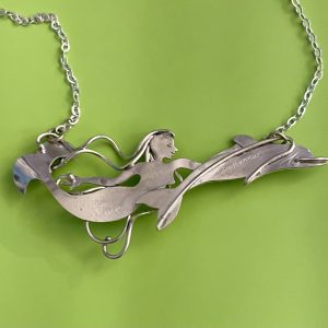 Wild Ride, a mermaid swimming with a dolphin, in sterling silver
