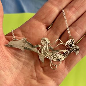 Wild Ride, a mermaid swimming with a dolphin, in sterling silver