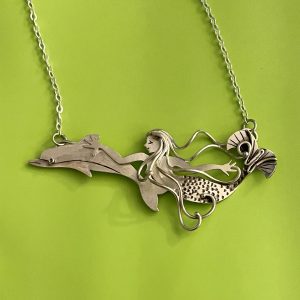 Wild Ride, a mermaid swimming with a dolphin, in sterling silver