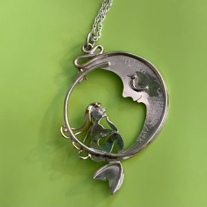 Sterling silver mermaid sitting on a moon necklace, this is Wish