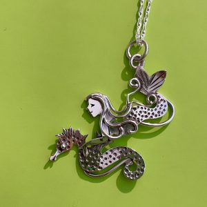 "On the Hunt" mermaid and seahorse in sterling silver, diving together