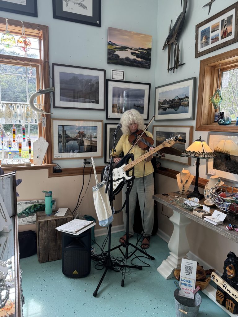 Hatteras musician Lisa Cooper playing at Blue Lagoon in Frisco during Rock The Cape in 2025. Photo courtesy of Dare Arts